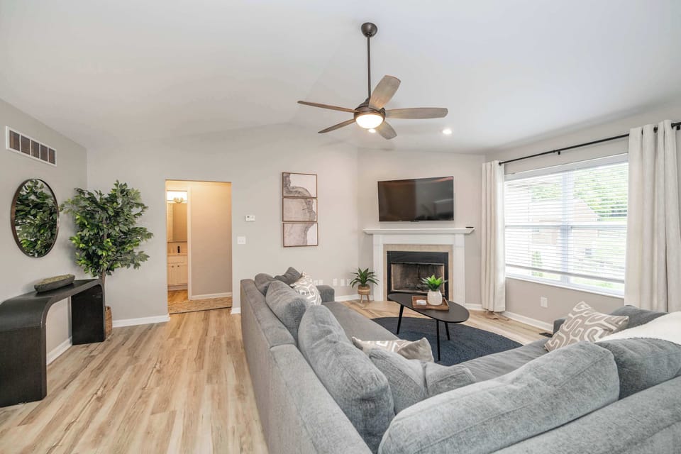 Curl up in the chic living room & enjoy a movie night at home