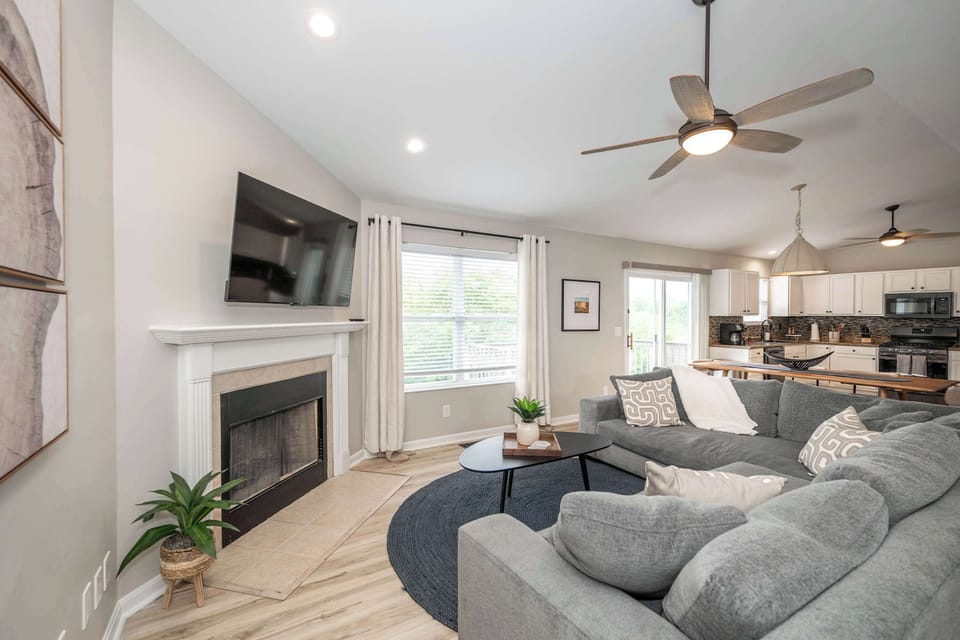 Curl up in the chic living room & enjoy a movie night at home