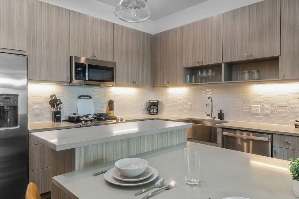 As you open the kitchen, you discover an assortment of coffee pods, and sugar, ensuring you have everything you need for a perfect morning or afternoon pick-me-up.