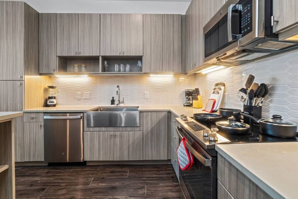 As you open the kitchen, you discover an assortment of coffee pods, and sugar, ensuring you have everything you need for a perfect morning or afternoon pick-me-up.