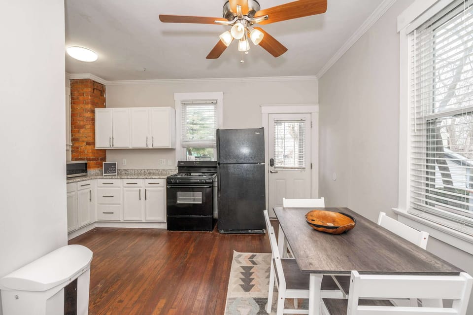 The chic eat-in kitchen offers ample space & all the comforts of home