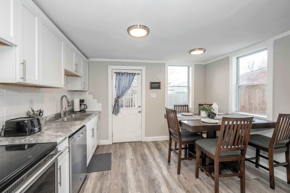 The bright, cozy kitchen offers ample space & all the comforts of home