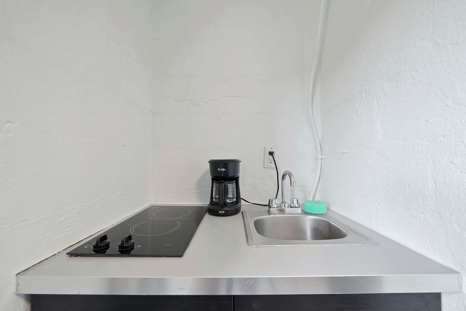 The stylish kitchen offers ample storage space & every home comfort