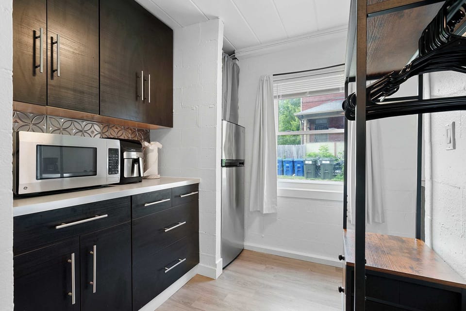 The stylish kitchen offers ample storage space & every home comfort