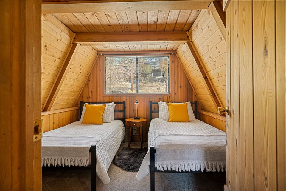 Bedroom two featuring two single beds.