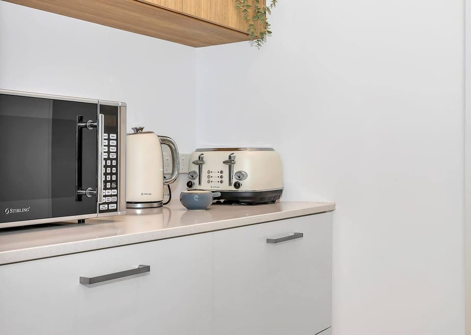 The butler’s pantry offers extra storage and all the essentials, adding a touch of convenience to your experience.
