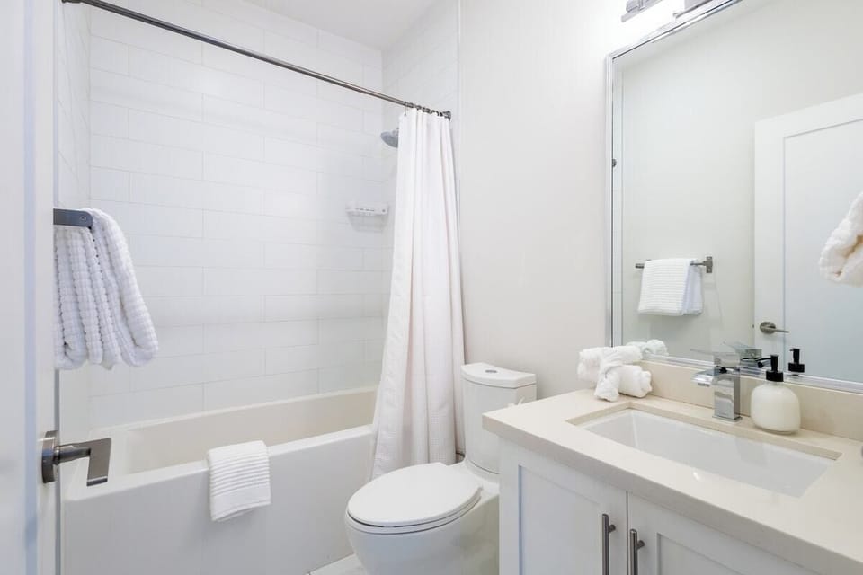 Unwind with a soak in the bathtub, or refresh yourself in the sleek shower in this stylish bathroom.