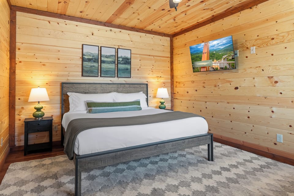 King bedroom with a twin trundle, TV, and full ensuite bathroom.