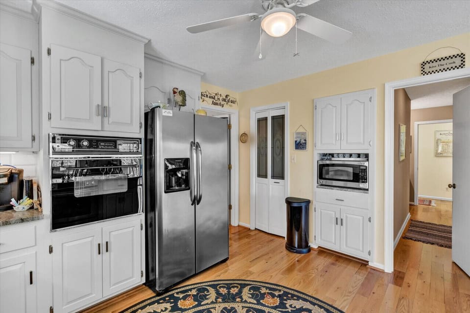 Sleek kitchen design with all the utensils you need for home-cooked meals.