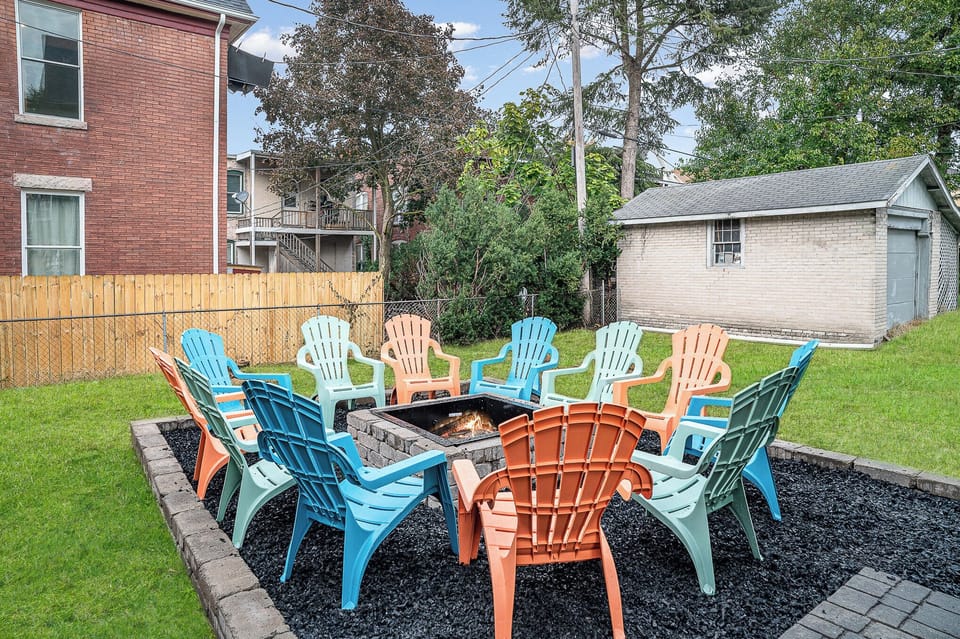 Shared backyard space with chairs and firepit