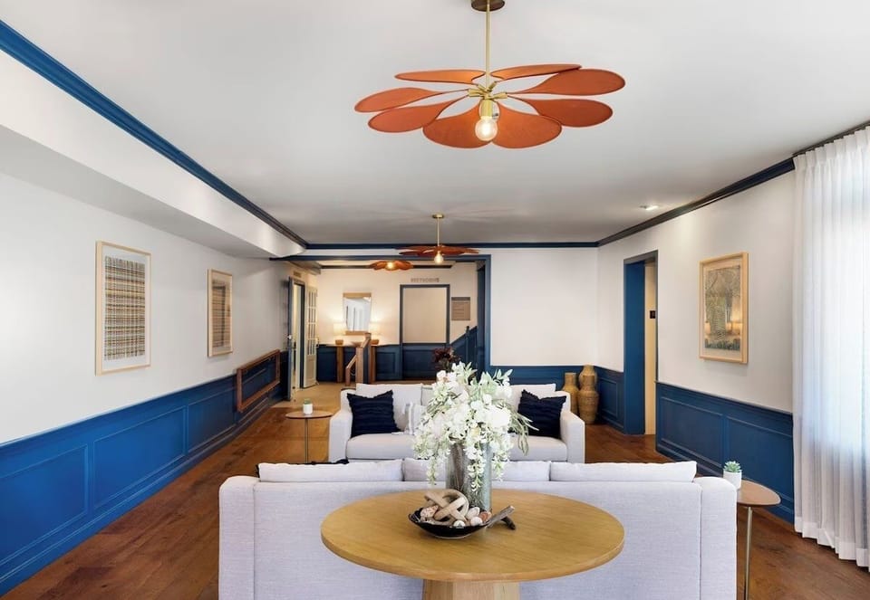 Unwind on plush sofas in a bright, stylish lounge.