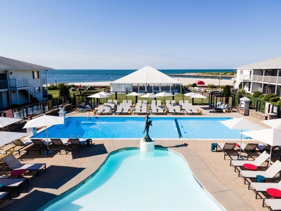 Dive into sparkling pools with ocean breezes all day.