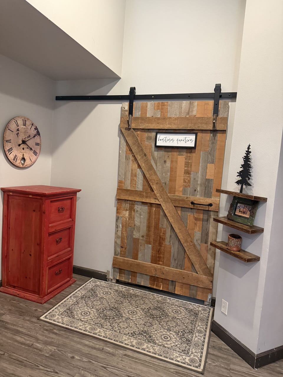 Hostess quarters is separated by a barndoor at the back of the house.