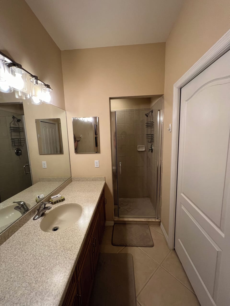 Master bath has walk-in tiled shower