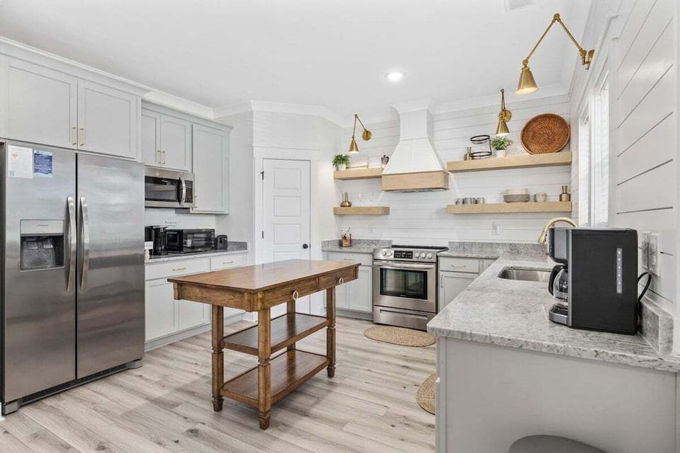 Cook up your favorite meals in this spacious open kitchen, complete with modern appliances and everything you need—even a popcorn machine for fun nights in!