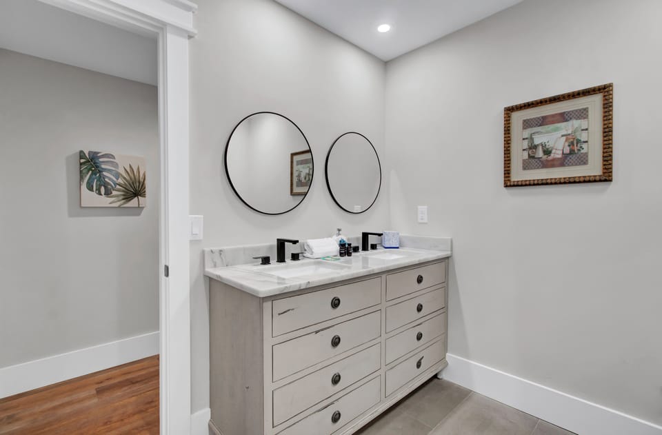 Dual sinks in primary bedroom's ensuite.