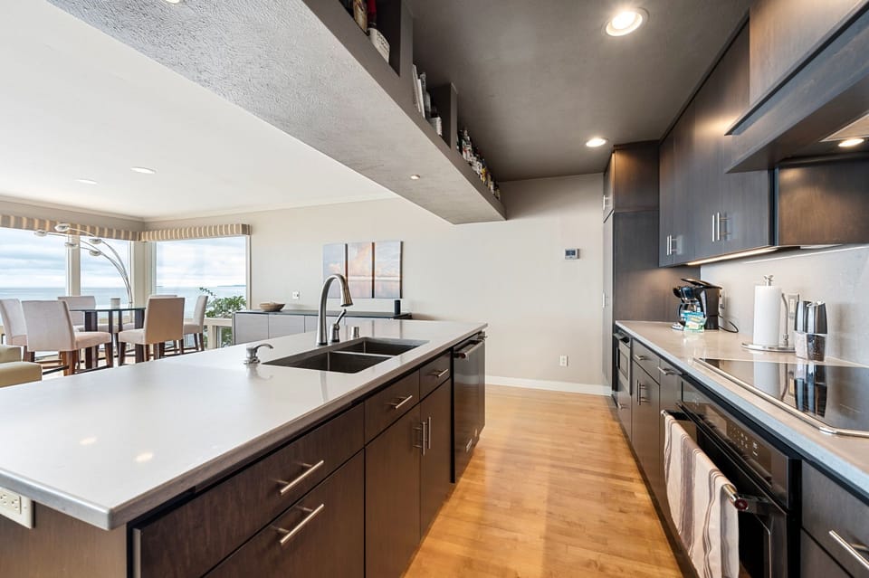 The well-stocked chef's kitchen offers the perfect setting for creating delicious meals and snacks, with ample space for entertaining guests.