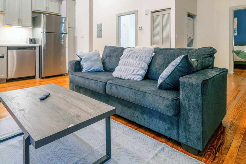 Living Room: Make yourself at home in the cozy living room with a comfy sofa and TV to unwind.