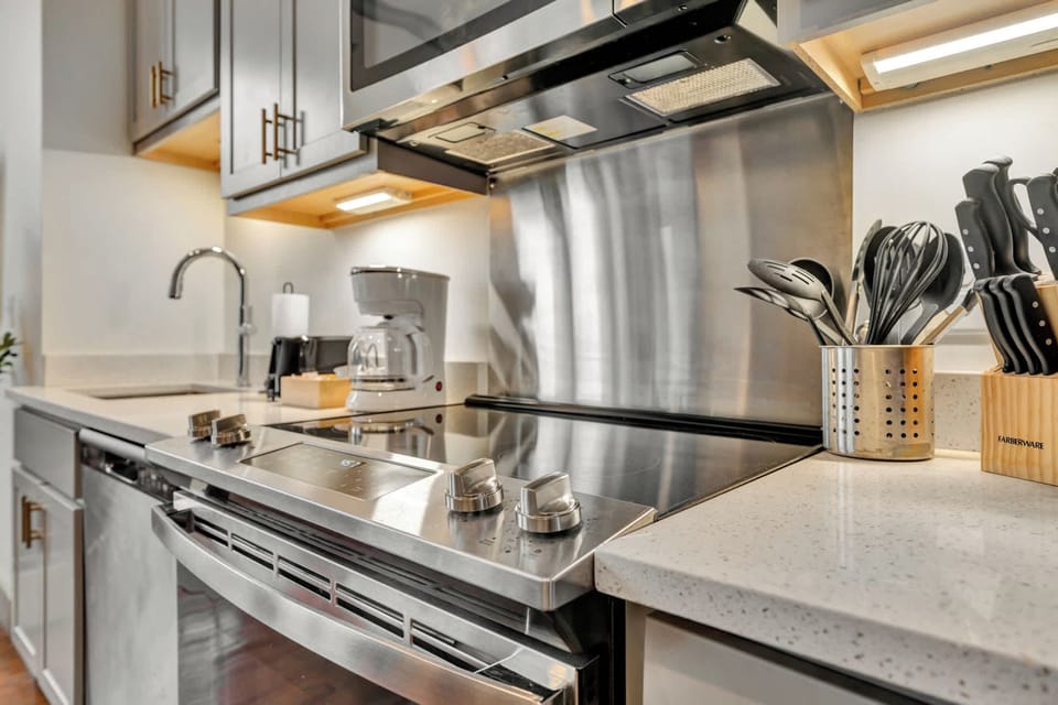 Kitchen: Spacious kitchen with updated cabinetry and modern appliances, perfect for preparing meals. 