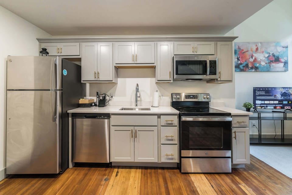 Kitchen: Modern kitchen with sleek stainless-steel appliances and ample counter space.