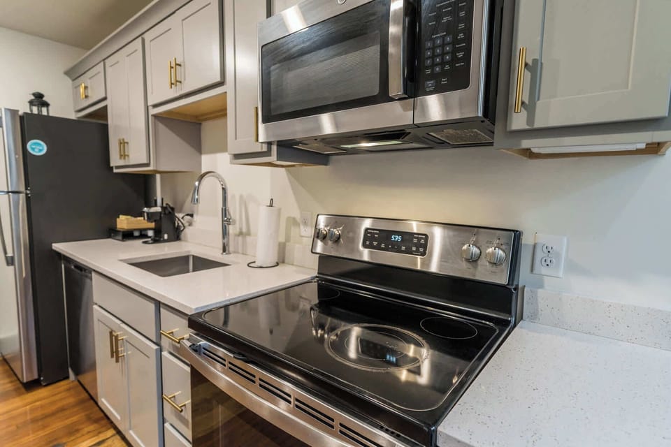Kitchen: Modern kitchen with sleek stainless-steel appliances and ample counter space.