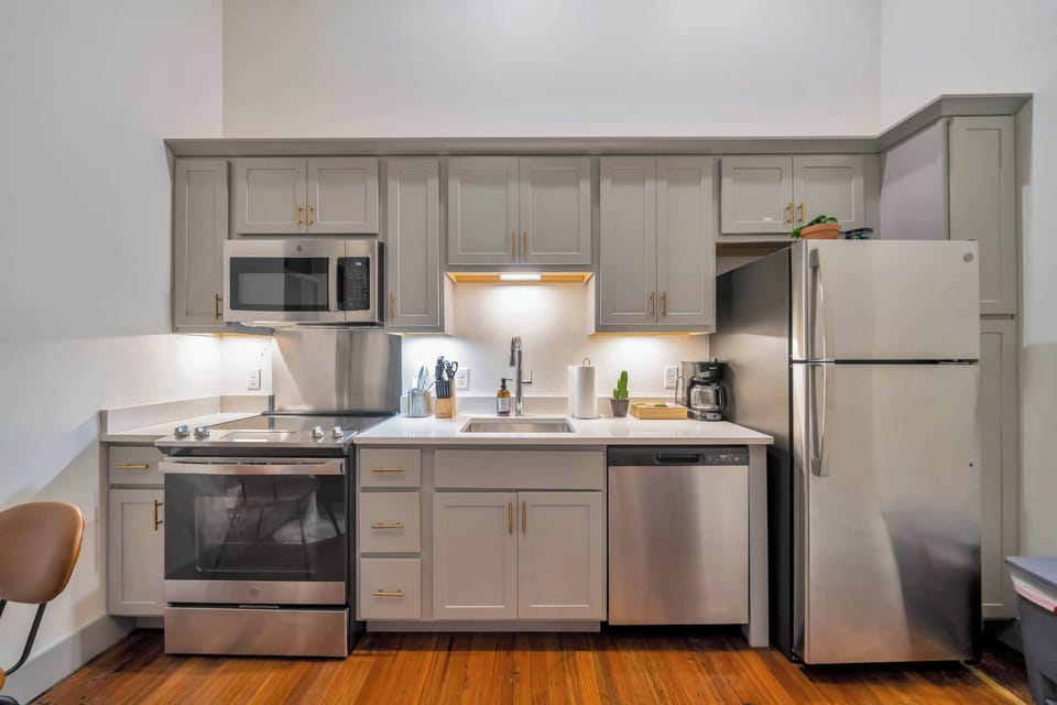 Kitchen: Modern kitchen with sleek stainless-steel appliances and ample counter space.