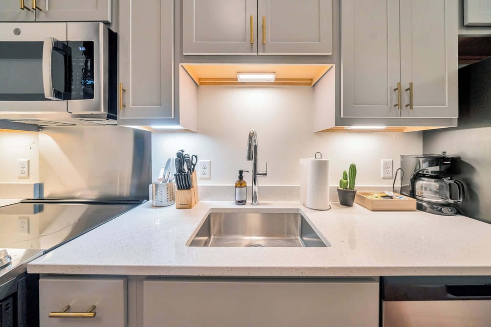 Kitchen: Modern kitchen with sleek stainless-steel appliances and ample counter space.