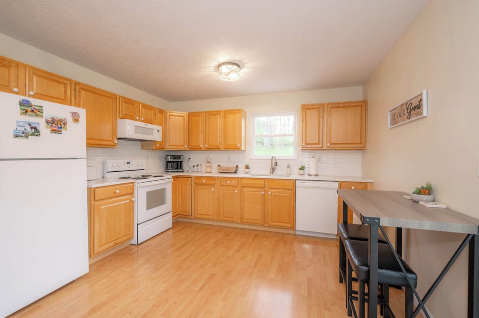 The warm, inviting kitchen offers ample space & all the comforts of home