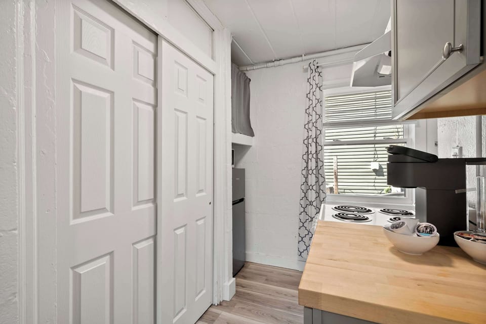 The chic kitchen provides plenty of storage and all the comforts of home