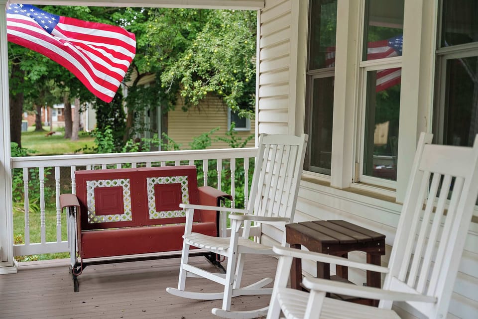 Sip morning coffee or an evening cocktail on the serene front porch