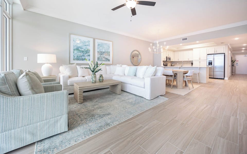 Relax on the cozy sofa with a queen sleeper in this inviting family room with breathtaking beachfront views