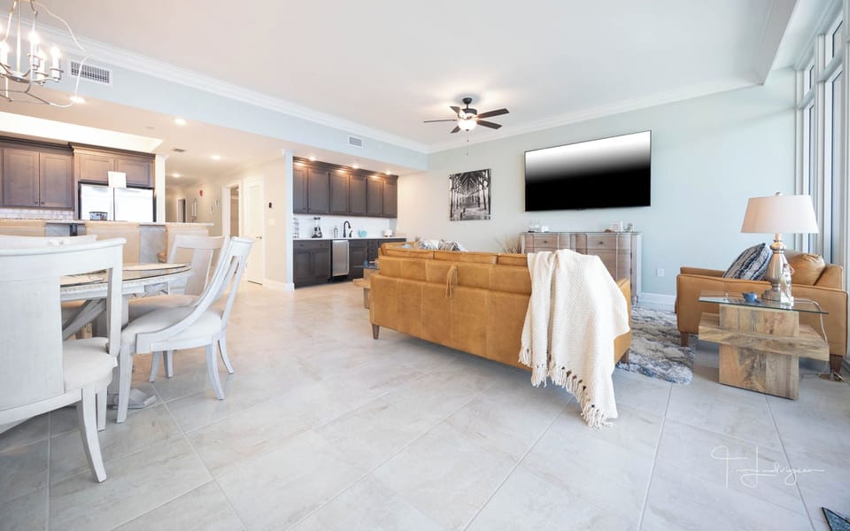 Relax on the cozy sofa with a queen sleeper in this inviting family room with breathtaking beachfront views