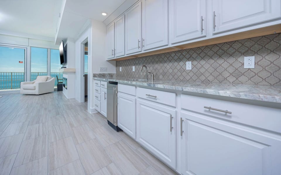 Grab a chilled drink from the fridge or create your favorite cocktail at the wet bar