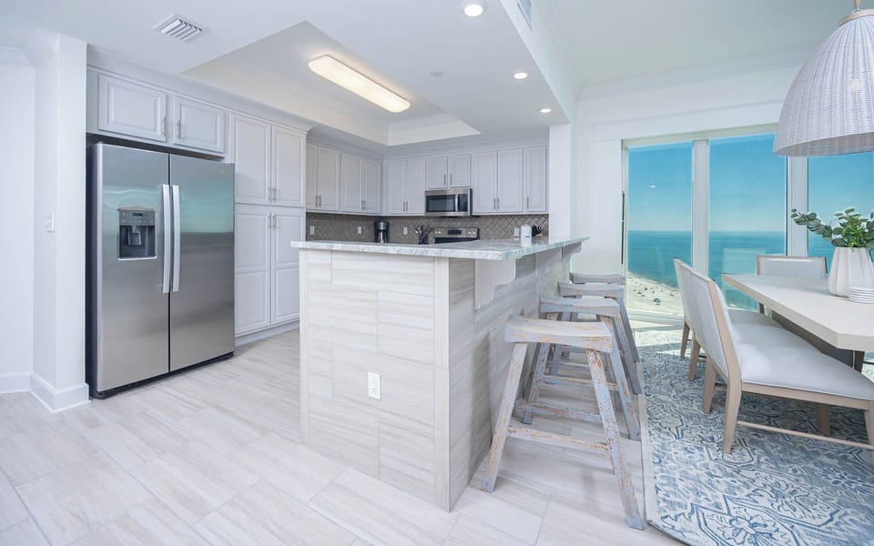 Sip your morning coffee at the breakfast bar and get ready for a beach day in this stylish space
