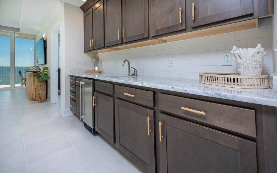 Grab a chilled drink from the fridge or create your favorite cocktail at the wet bar