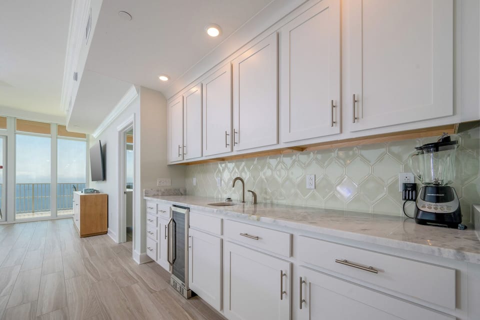 Grab a chilled bottle from the wine cooler, blend a fruit smoothie, or create your favorite cocktail at the wet bar