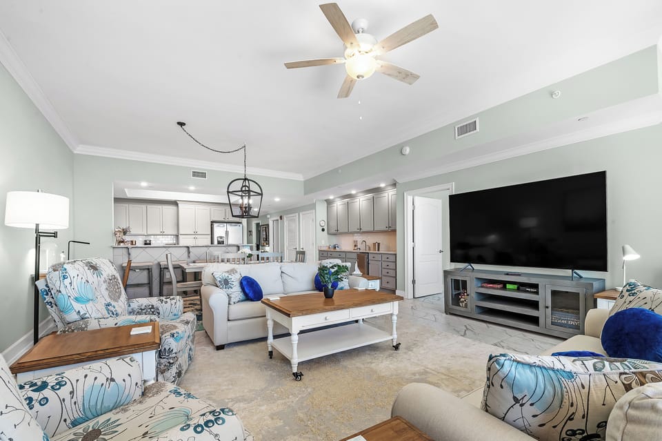 Unwind on the plush sofa with a good movie and relax after a day at the beach