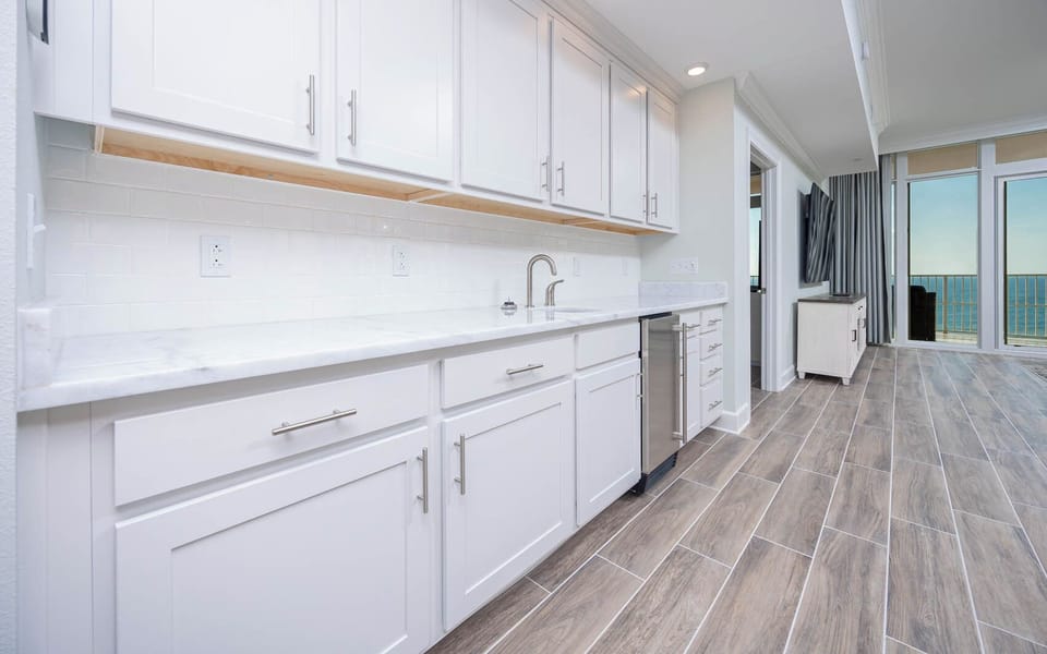 Grab a chilled drink from the fridge or create your favorite cocktail at the wet bar