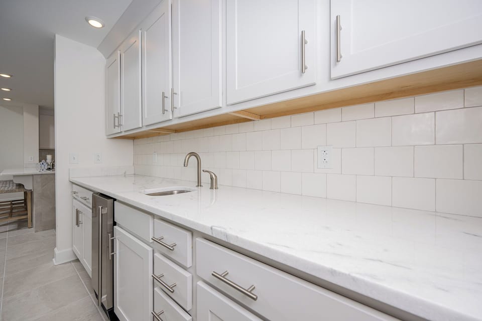 Grab a chilled drink from the fridge or create your favorite cocktail at the wet bar