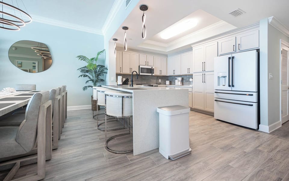 Savor your morning coffee under pendant lights and prep meals in this stylish kitchen