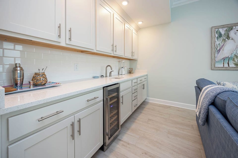 Help yourself to chilled bottles from the wine fridge and mix cocktails at the wet bar