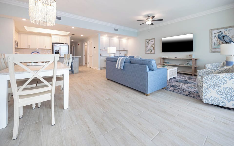 Kick off your shoes, sink into the blue sofa with a queen sleeper, and stream favorite shows on the TV