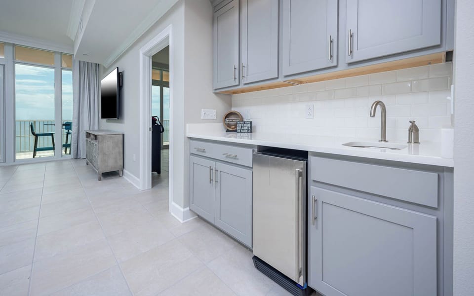 Grab a chilled drink from the fridge or create your favorite cocktail at the wet bar