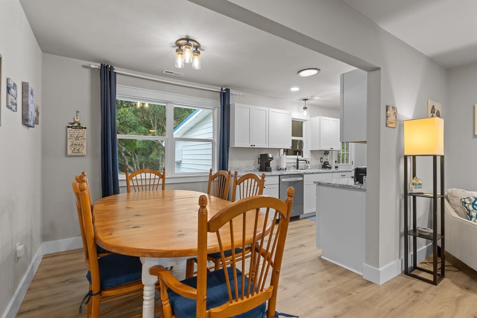 Bright dining room with large window and inviting natural light.