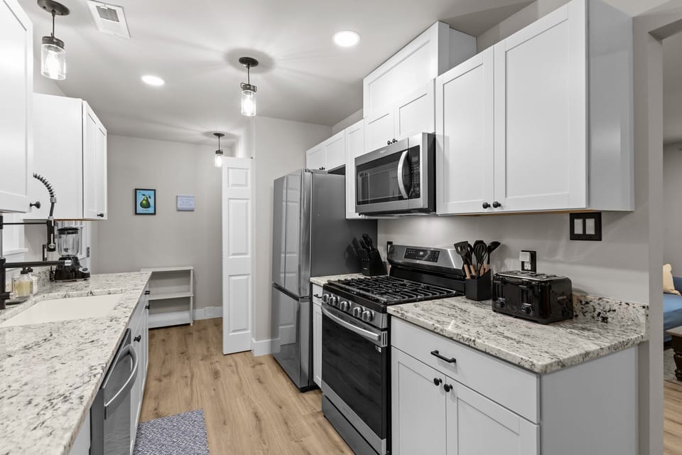 Stylish kitchen with 5-burner gas stove and over-range microwave