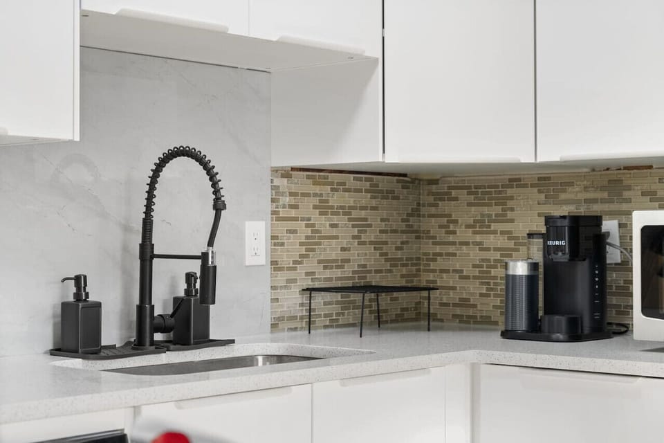 Enjoy the convenience of a fully equipped kitchen, featuring a Keurig coffee machine, toaster, fridge, dishwasher, and all the essentials, including salt and pepper, to make your stay feel like home.