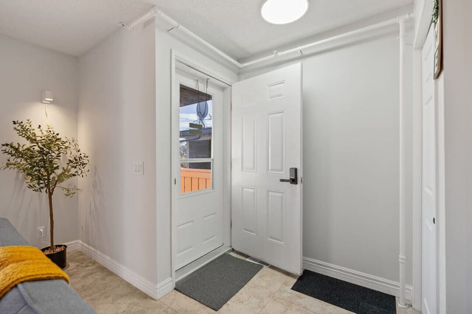 Relax in the spacious living room featuring a Futon Sofa Bed with linens provided, a smart TV with Netflix, and a variety of board games for your entertainment.
