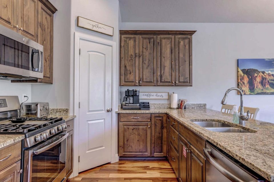 Granite countertops, gas stove and oven, stainless steal appliances