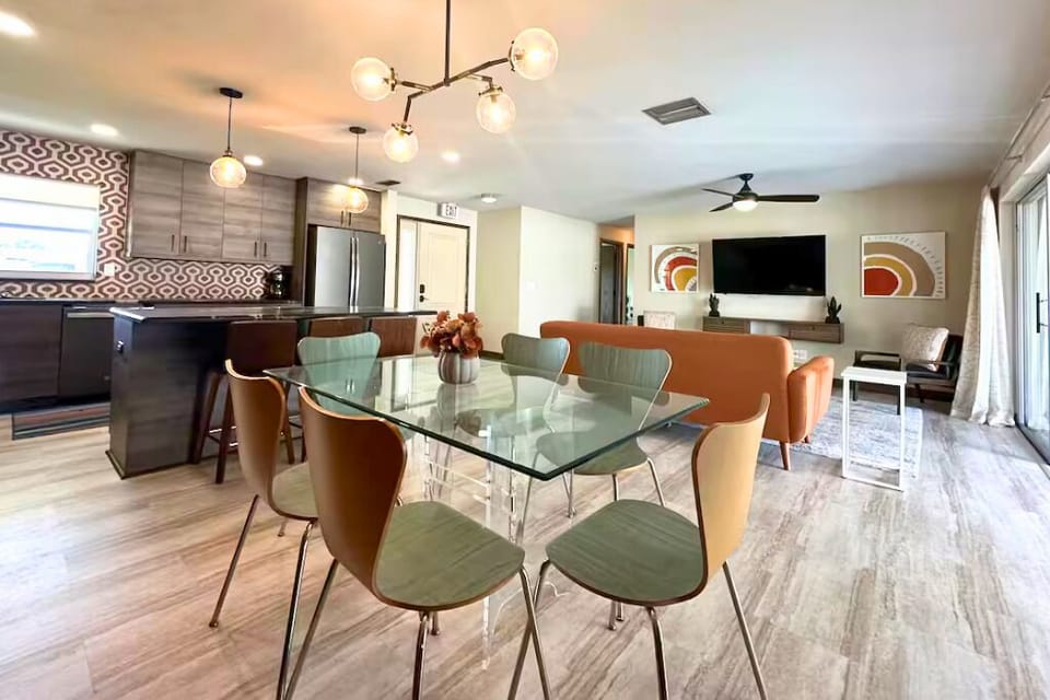 We have a glass dining table that accommodates six guests.