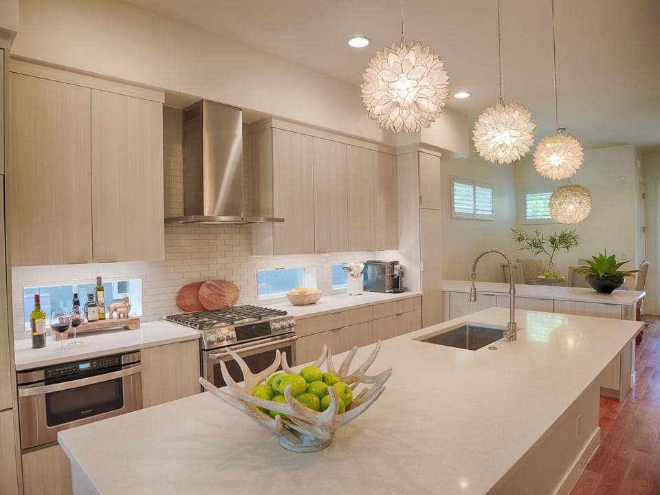 The kitchen is equipped with a 5 burner gas range and griddle option.
